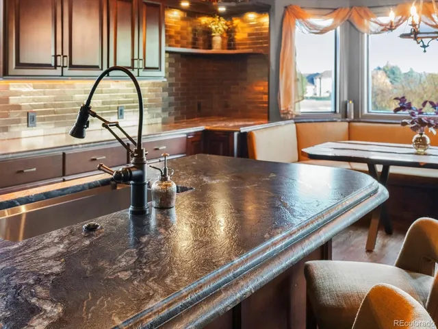 a kitchen with a stove and a refrigerator