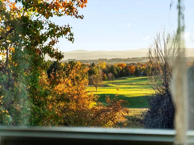 a view of a swimming pool with an outdoor seating and a yard