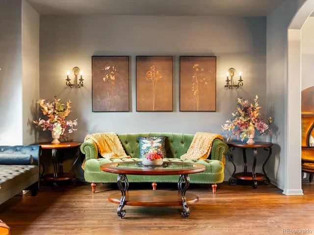 a living room with furniture and a potted plant