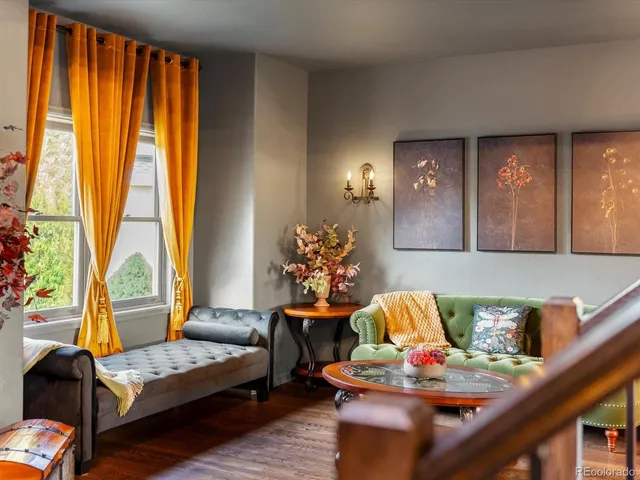 a bed sitting in a balcony next to a window