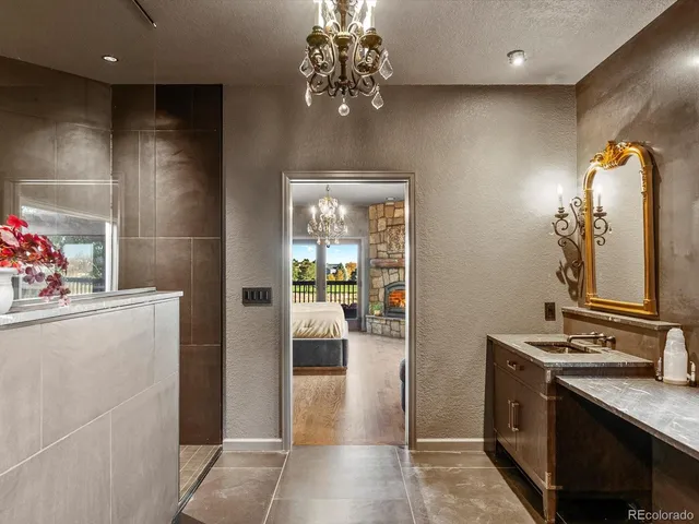 a kitchen with stainless steel appliances granite countertop a refrigerator and a stove