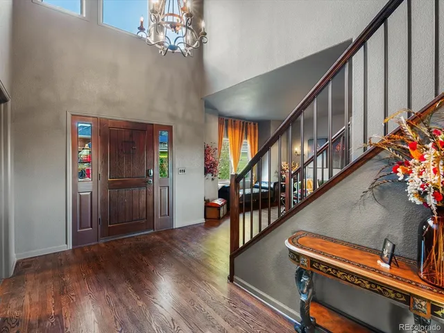 a living room with fireplace furniture and a large window