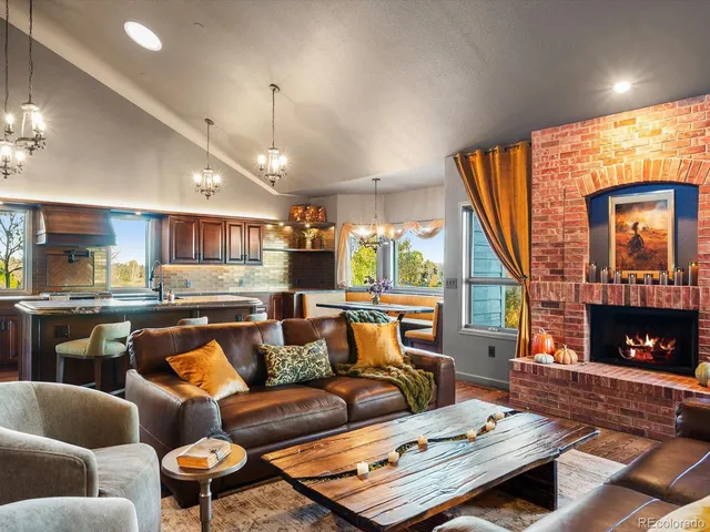 a living room with furniture and kitchen view