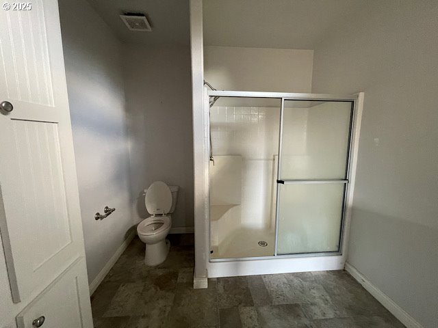 9290 Southwest 3115th Road Culver, OR 97734 - Photo 11 of 21 a bathroom with a granite countertop toilet and a shower