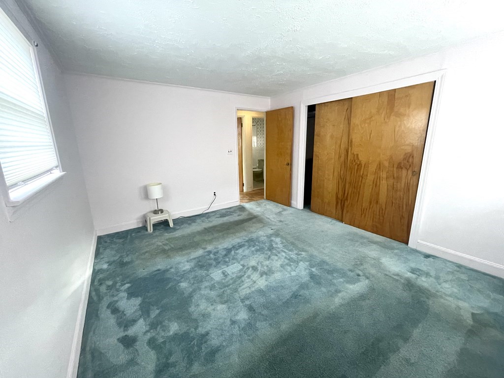 31 Bear Hill Road Stoneham, MA 02180 - Photo 13 of 30 a view of a livingroom with a bench