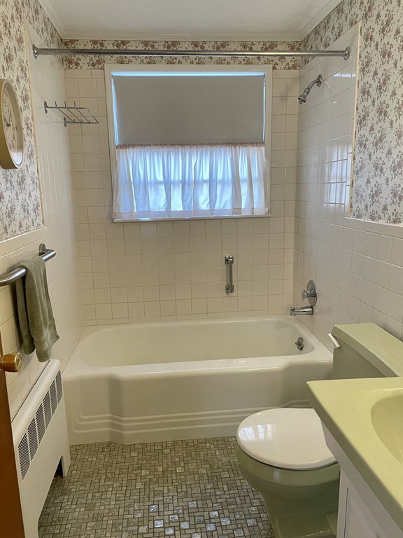 31 Bear Hill Road Stoneham, MA 02180 - Photo 15 of 30 a bathroom with a sink and a bathtub