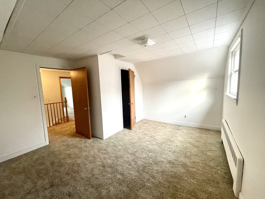 31 Bear Hill Road Stoneham, MA 02180 - Photo 18 of 30 a view of an empty room and a window