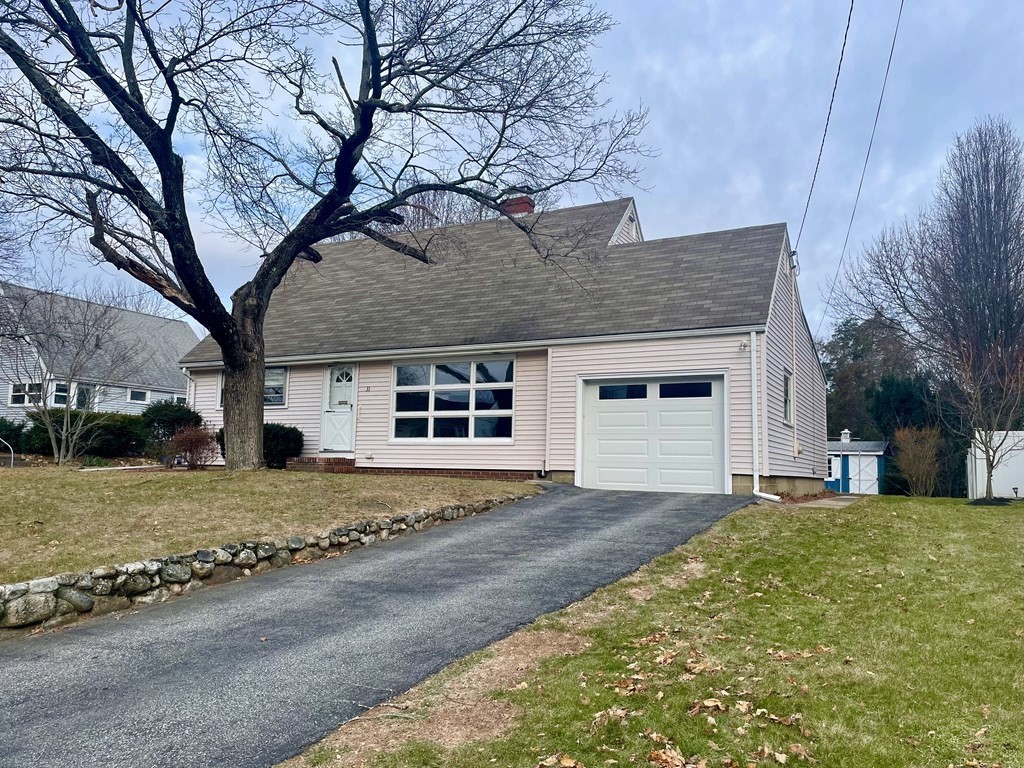 31 Bear Hill Road Stoneham, MA 02180 - Photo 28 of 30 a front view of a house with a yard and garage
