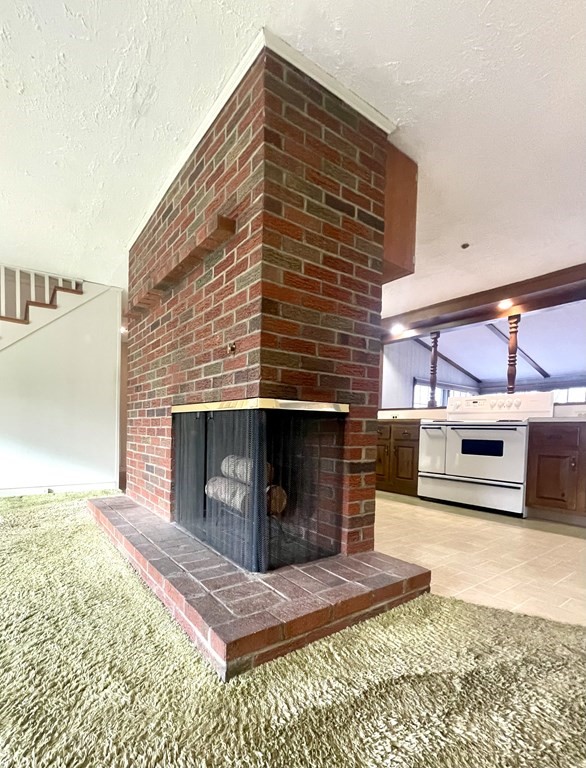 31 Bear Hill Road Stoneham, MA 02180 - Photo 5 of 30 a view of a fireplace and an empty room