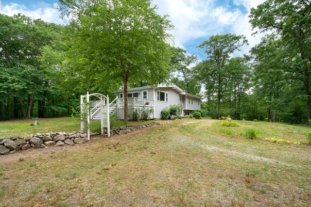 a house view with a backyard space