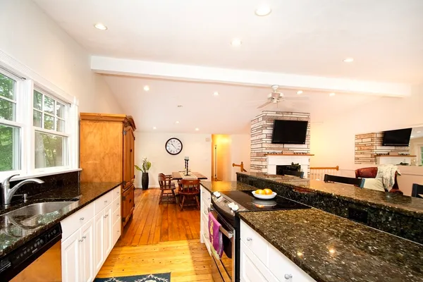a large kitchen with lots of counter space and a sink