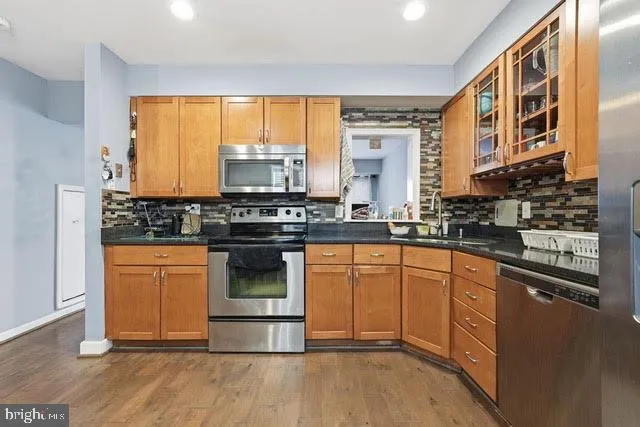 a living room with a bed and a window