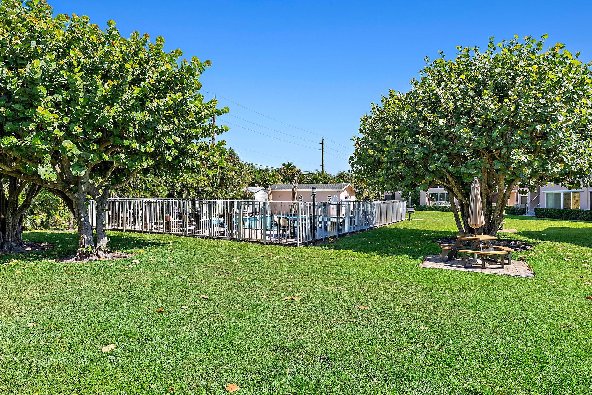 12416 Alternate A1a Palm Beach Gardens, Unit P7 Palm Beach Gardens, FL 33410 - Photo 18 of 23 Community Pool & Picnic Areas
