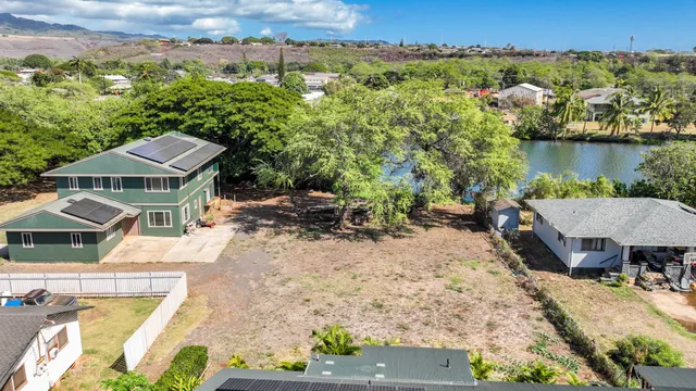 an aerial view of a house with outdoor space
