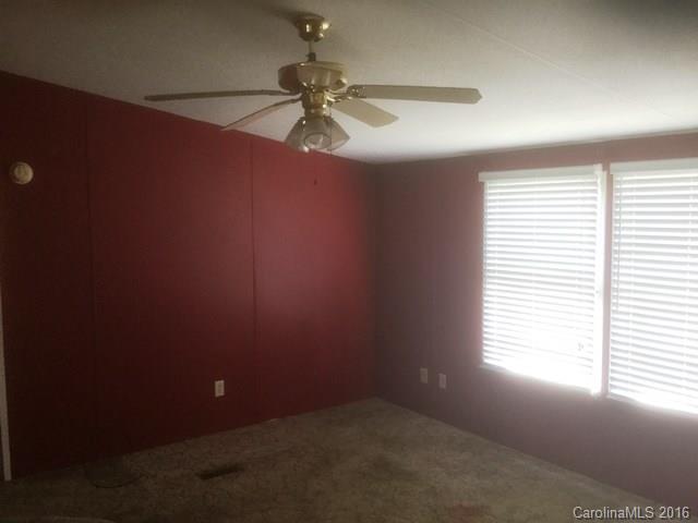 2033 Brer Rabbit Run Rock Hill, SC 29730 - Photo 2 of 13 an empty room with a window and a fan