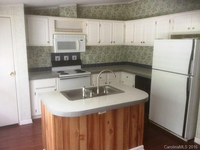 2033 Brer Rabbit Run Rock Hill, SC 29730 - Photo 3 of 13 a kitchen with a sink a refrigerator and cabinets