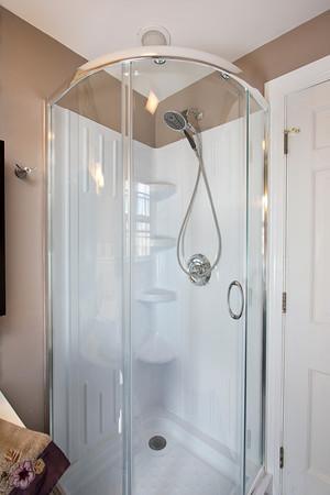 70 Longfellow Road Wellesley, MA 02481 - Photo 10 of 19 a bathroom with a glass shower door and a shower