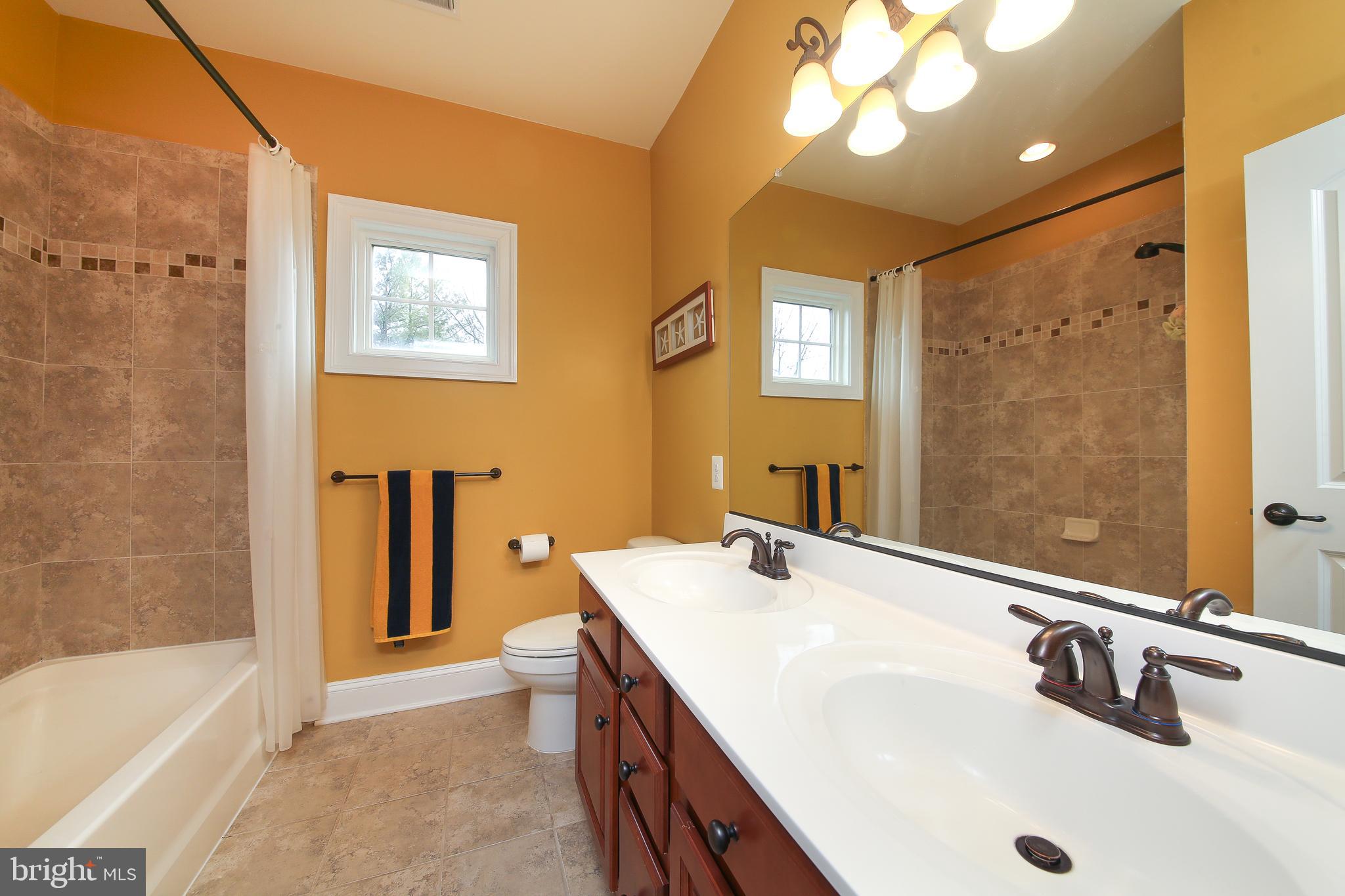 342 Alexander Drive Telford, PA 18969 - Photo 20 of 31 a bathroom with a tub sink and mirror