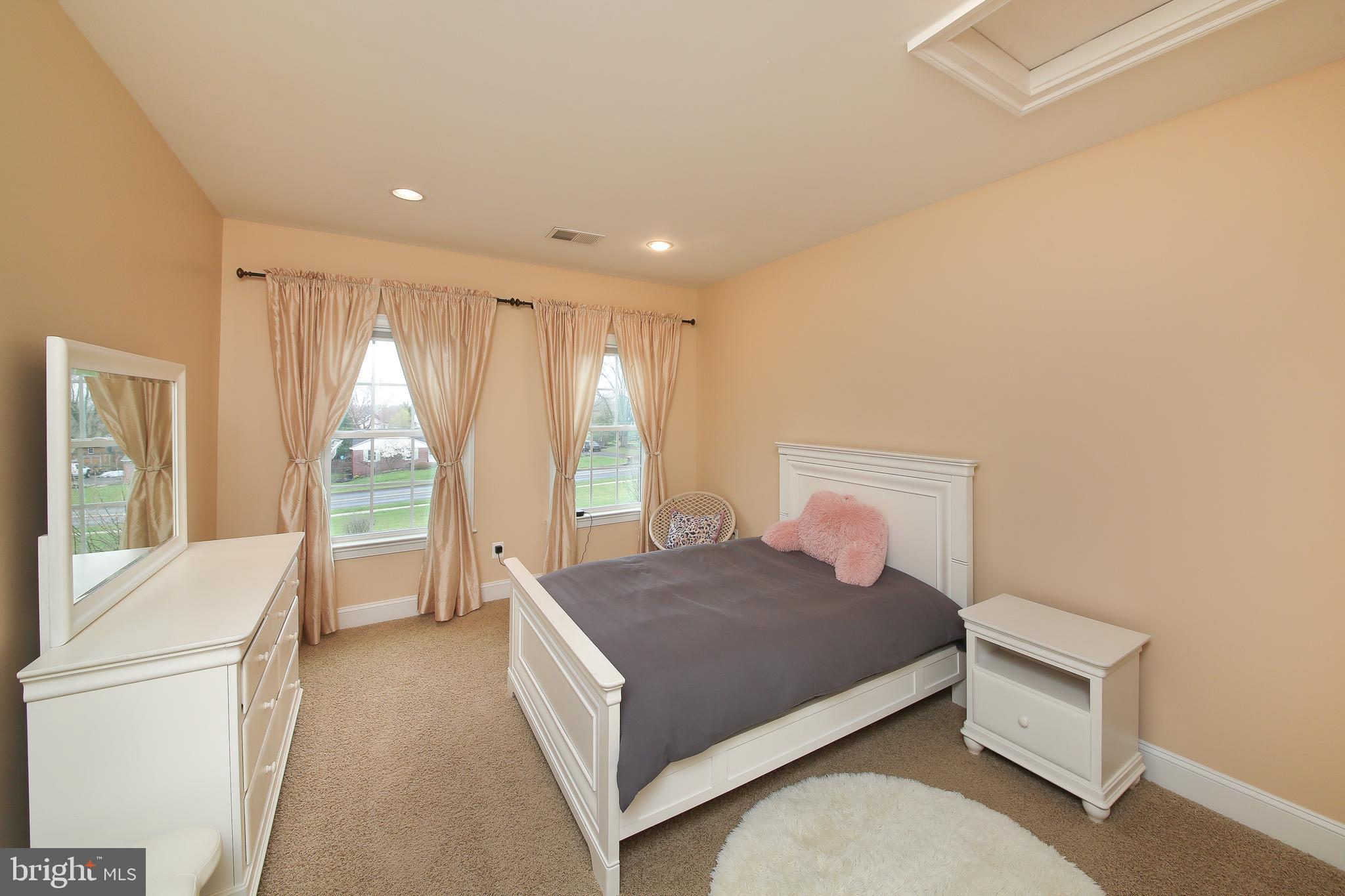 342 Alexander Drive Telford, PA 18969 - Photo 21 of 31 a bedroom with a large bed and a large window