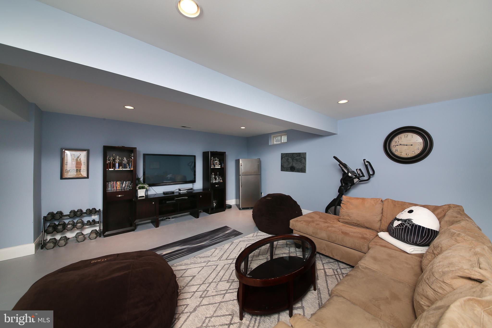 342 Alexander Drive Telford, PA 18969 - Photo 24 of 31 a living room with furniture and a flat screen tv
