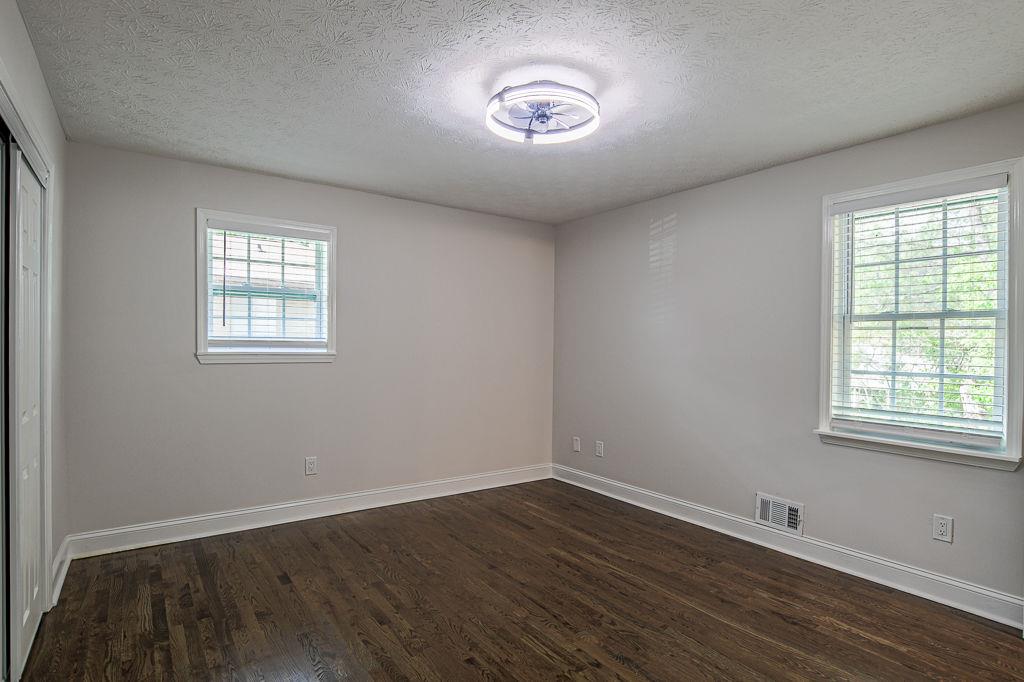 2248 Willoby Court Morrow, GA 30260 - Photo 12 of 31 an empty room with wooden floor and windows