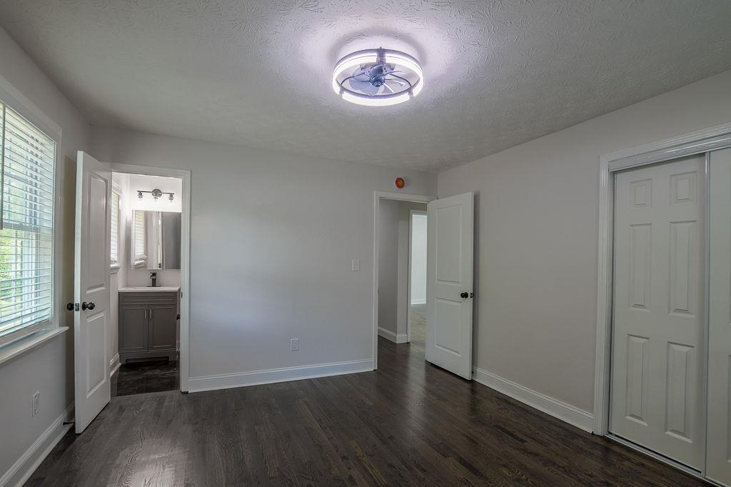2248 Willoby Court Morrow, GA 30260 - Photo 21 of 31 an empty room with wooden floor and windows