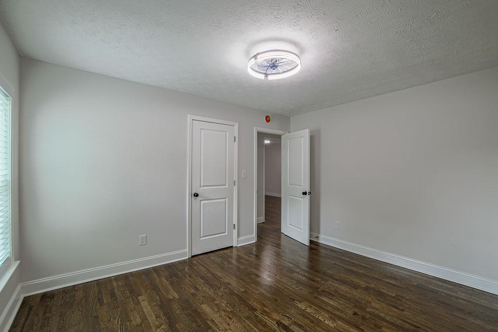 2248 Willoby Court Morrow, GA 30260 - Photo 22 of 31 a view of an empty room and wooden floor