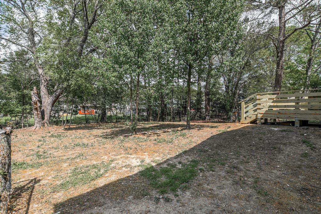 2248 Willoby Court Morrow, GA 30260 - Photo 31 of 31 a view of a yard with large trees