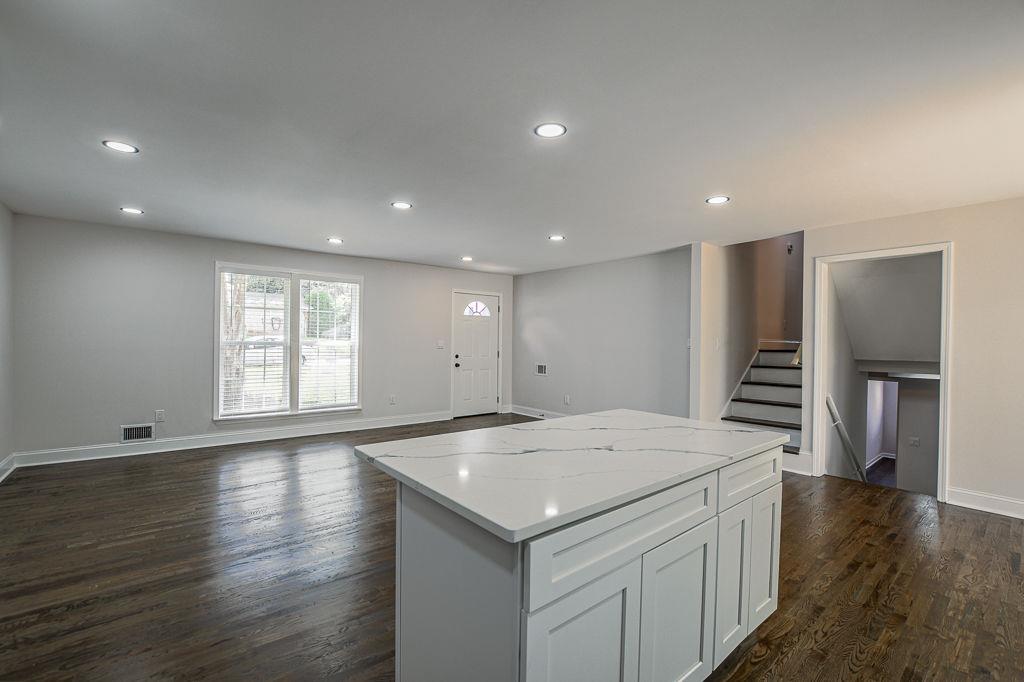 2248 Willoby Court Morrow, GA 30260 - Photo 7 of 31 an empty room with wooden floor and entrance to ceiling window