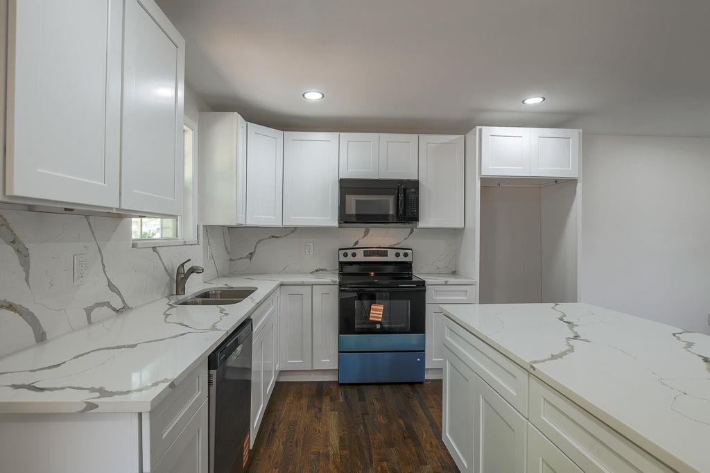 2248 Willoby Court Morrow, GA 30260 - Photo 8 of 31 a kitchen with a sink a stove and refrigerator