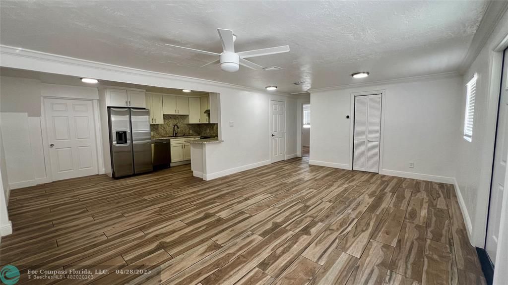 5737 Greene Street Hollywood, FL 33021 - Photo 4 of 13 a view of a refrigerator in kitchen and wooden floor