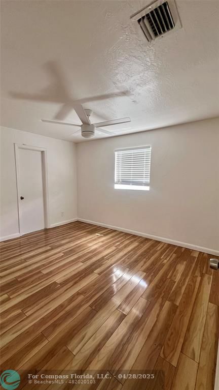 5737 Greene Street Hollywood, FL 33021 - Photo 8 of 13 a view of a room with wooden floor
