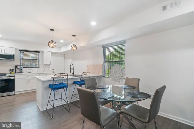 a view of a dining room with furniture and window