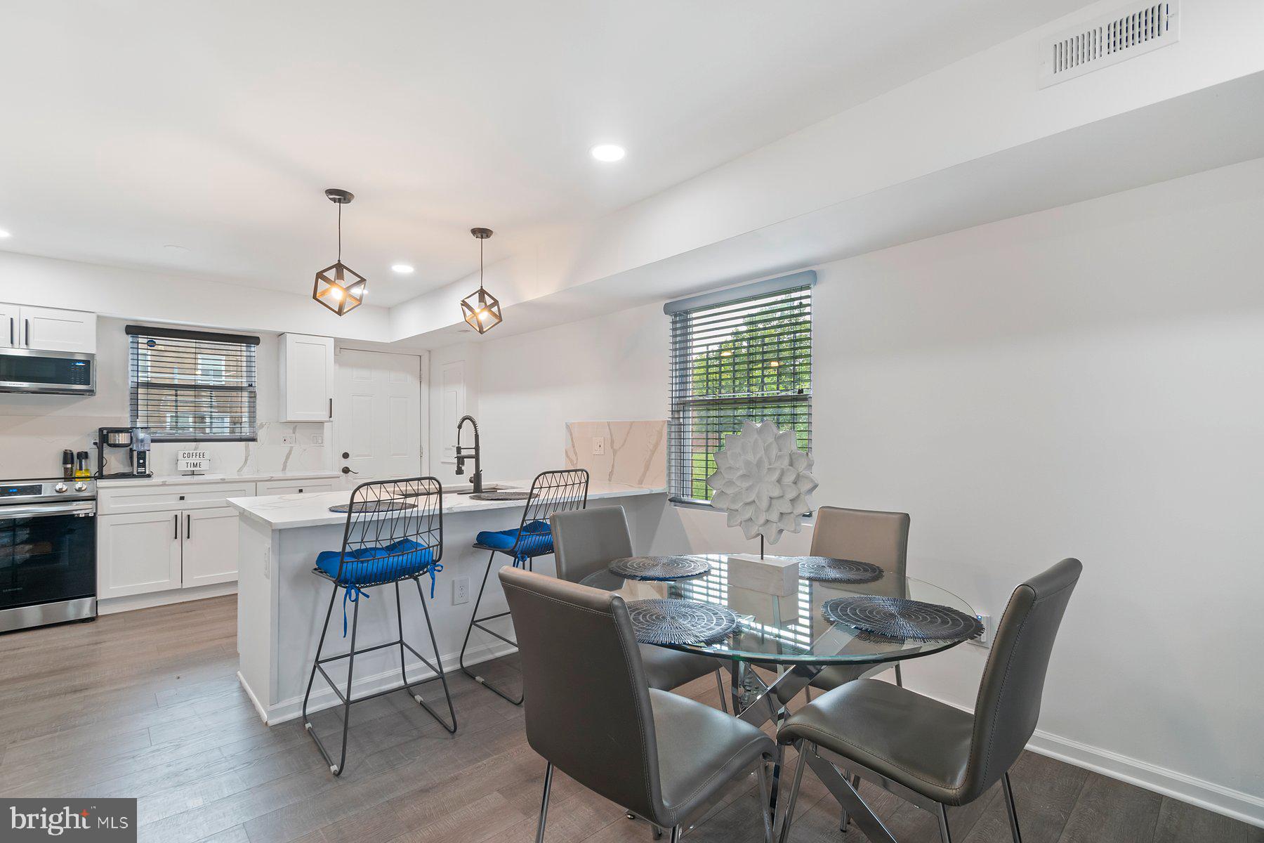 a view of a dining room with furniture and window