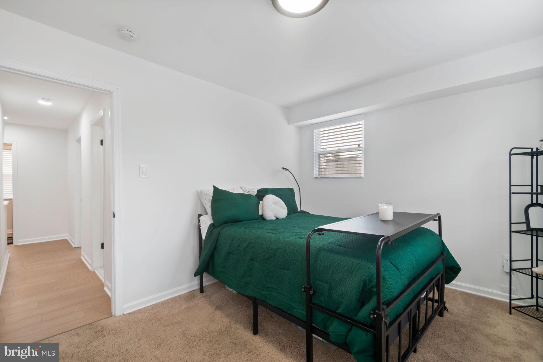 1221 East Oliver Street Baltimore, MD 21202 - Photo 10 of 26 a bedroom with a bed and a cabinets