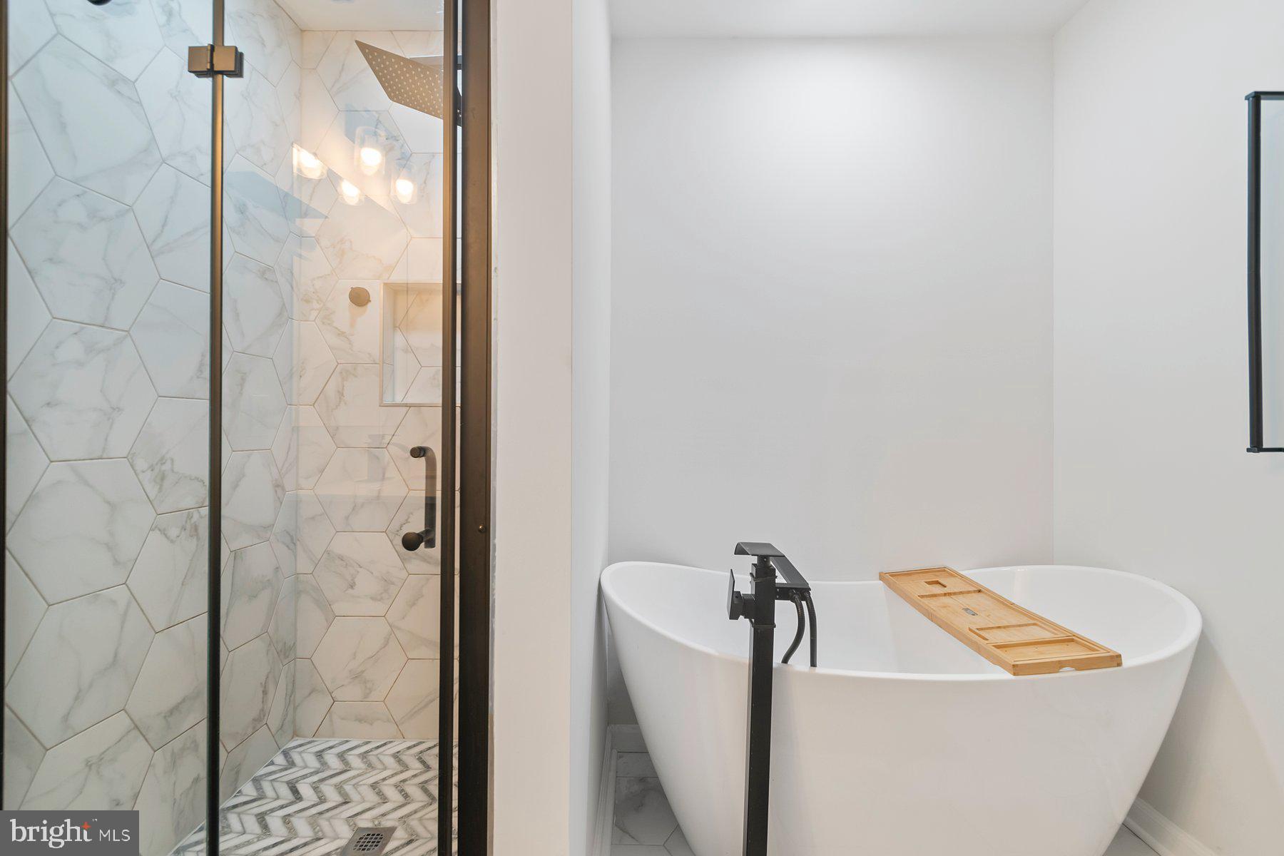 1221 East Oliver Street Baltimore, MD 21202 - Photo 18 of 26 a bathroom with a sink and shower