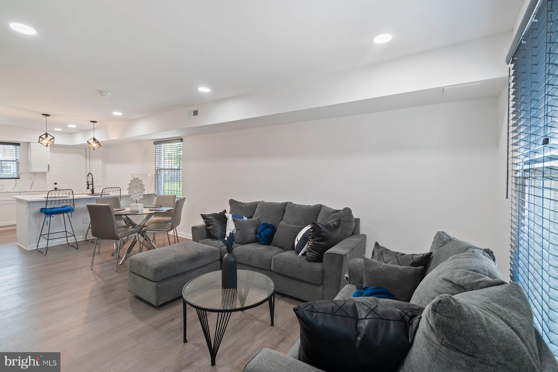 1221 East Oliver Street Baltimore, MD 21202 - Photo 4 of 26 a living room with furniture and kitchen view