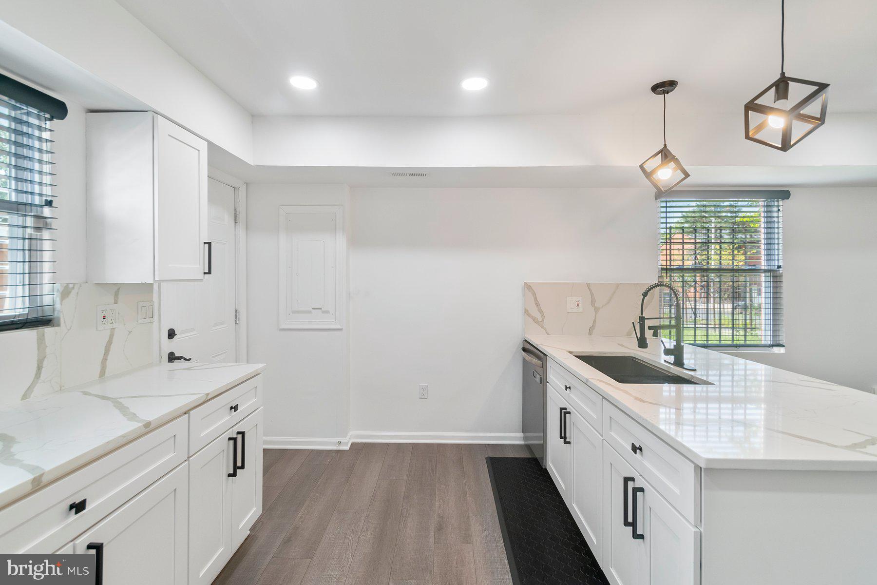 1221 East Oliver Street Baltimore, MD 21202 - Photo 9 of 26 a kitchen with sink and cabinets