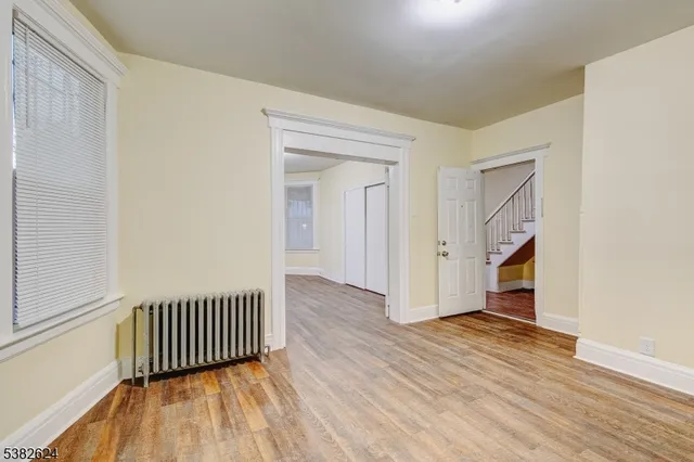 a view of a kitchen with a sink and a window