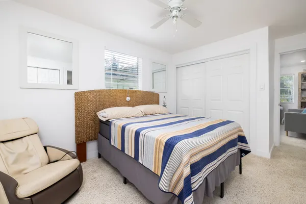 a bedroom with a bed and window