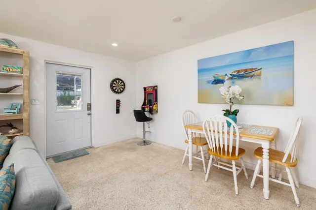a dining room with furniture and window