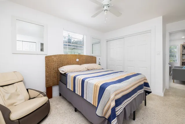 a bedroom with a bed and window