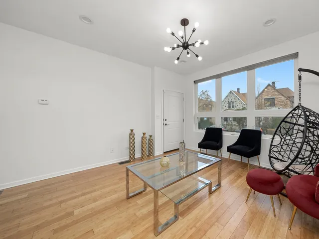 a bedroom with a bed and painting on the wall