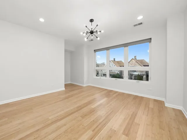 a kitchen with cabinets and white appliances