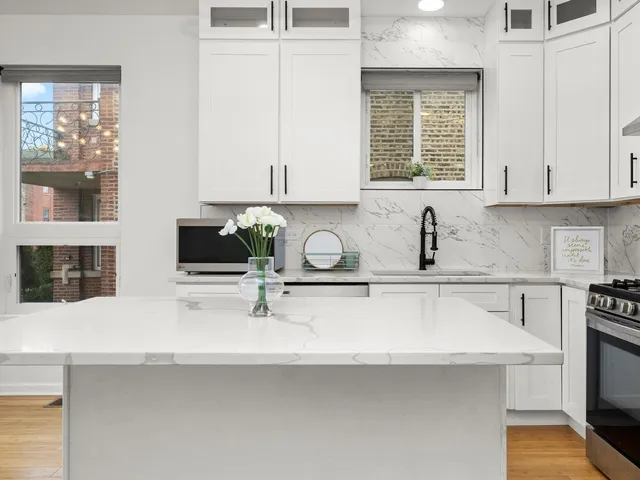 a kitchen with sink cabinets and window