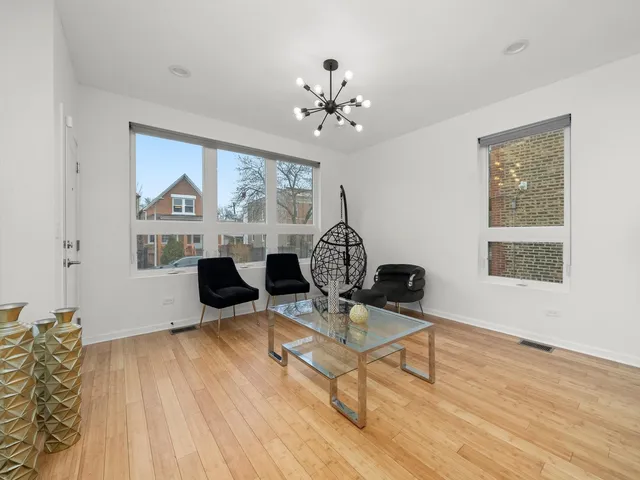 a bathroom with a sink mirror vanity and toilet