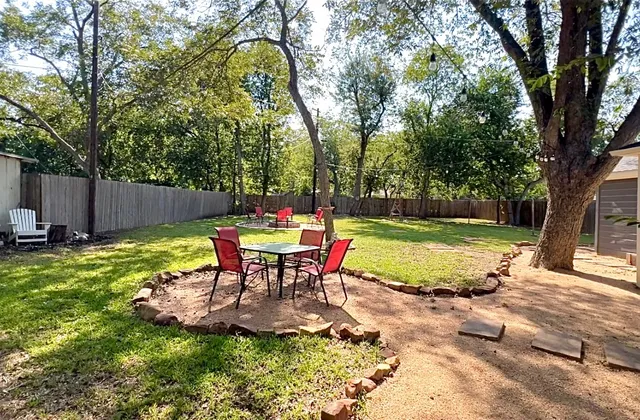 a view of a chairs and table in the patio