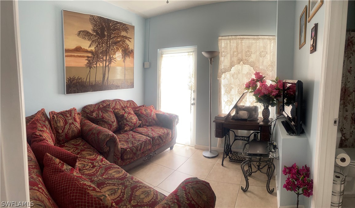 941 Happy Road North Fort Myers, FL 33903 - Photo 16 of 19 a living room with furniture and a window