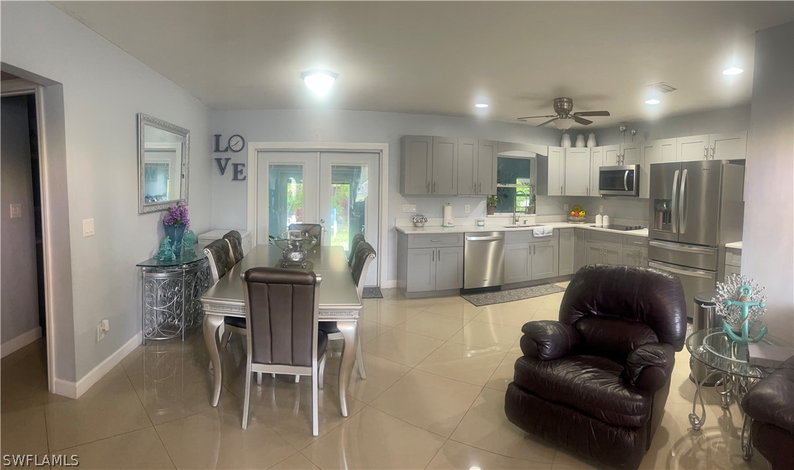 941 Happy Road North Fort Myers, FL 33903 - Photo 4 of 19 a living room with furniture and kitchen view