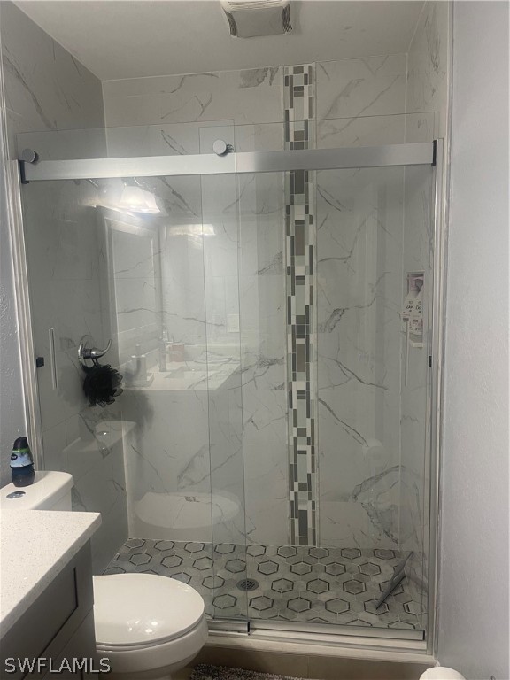 941 Happy Road North Fort Myers, FL 33903 - Photo 6 of 19 a bathroom with a shower and a toilet